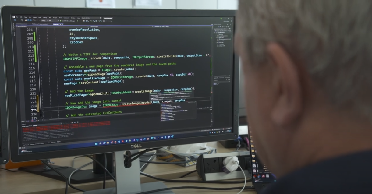 David solving a problem on his computer